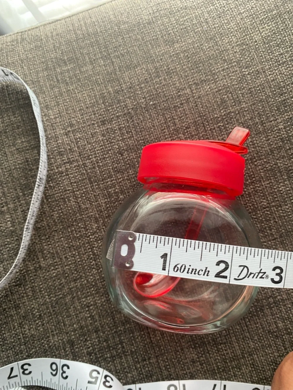 Clear Glass Honey Jar with Red Lid and Spoon